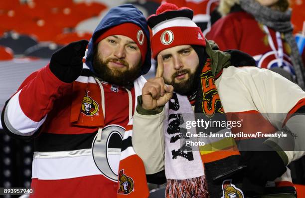 Fans pose for a photo following a game between the Ottawa Senators and the Montreal Canadiens during the of the 2017 Scotiabank NHL100 Classic at...