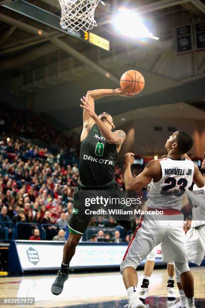 Geno Crandall of the North Dakota Fighting Hawks is fouled by Zach Norvell Jr. #23 of the Gonzaga Bulldogs in the second half at McCarthey Athletic...