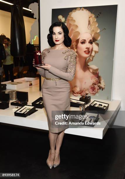 Burlesque dancer Dita Von Teese and luxury fragrance brand Heretic Parfum launch their candle and fragrance collaboration Scandalwood at Maxfield on...