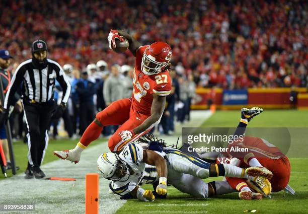 Running back Kareem Hunt of the Kansas City Chiefs carries the ball as free safety Adrian Phillips of the Los Angeles Chargers knocks him...