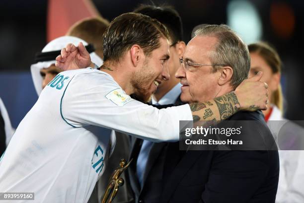 Sergio Ramos of Real Madrid celebrates with Real Madrid President Florentino Perez during the medal ceremony after the FIFA Club World Cup UAE 2017...