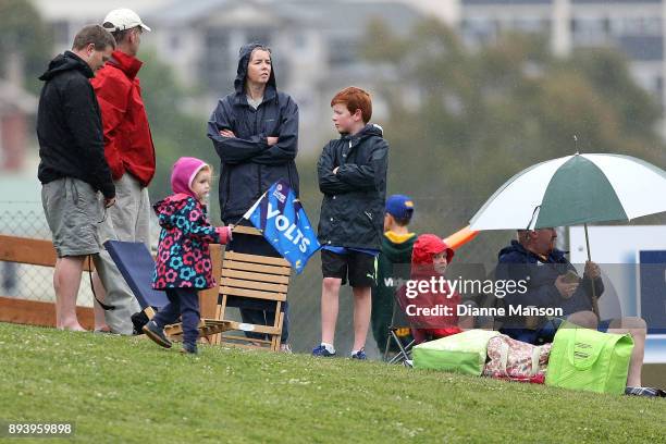 Supporters wait as rain delays play during the Twenty20 Supersmash match between Otago and Wellington on December 17, 2017 in Dunedin, New Zealand.