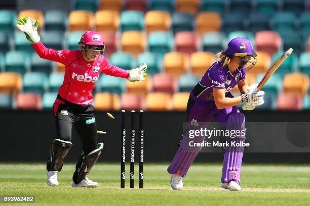 Alyssa Healy of the Sixers celebrates after Lauren Winfield of the Hurricanes is bolwed by Sarah Aley of the Sixers during the Women's Big Bash...