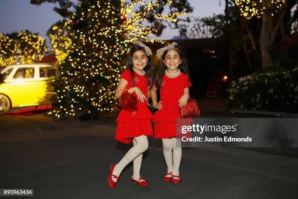 Bella Abir and Chloe Abir attend the Volkswagen Holiday Drive-In Event at Releigh Studios in Los Angeles, California on December 16, 2017.