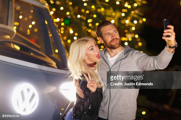 Julianne Hough and Brooks Laich attend the Volkswagen Holiday Drive-In Event at Releigh Studios in Los Angeles, California on December 16, 2017.