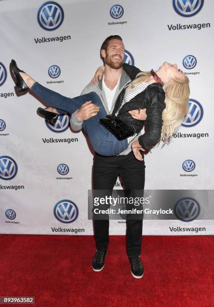 Brooks Laich and Julianne Hough attend the Volkswagen Holiday Drive-In Event at Releigh Studios in Los Angeles, California on December 16, 2017.