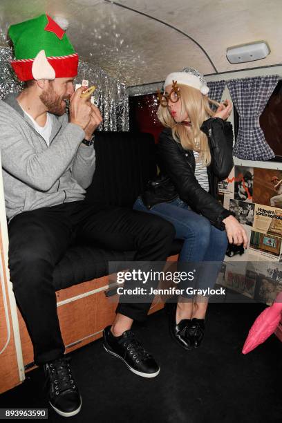 Brooks Laich and Julianne Hough attend the Volkswagen Holiday Drive-In Event at Releigh Studios in Los Angeles, California on December 16, 2017.