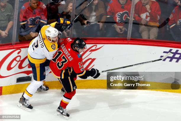 Johnny Gaudreau of the Calgary Flames skates against Anthony Bitetto of the Nashville Predators during an NHL game on December 16, 2017 at the...