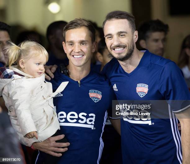 Stuart Holden, left, with daughter Kennedy and Euan Holden during the Kick In For Houston Charity Soccer Match at BBVA Compass Stadium on December...