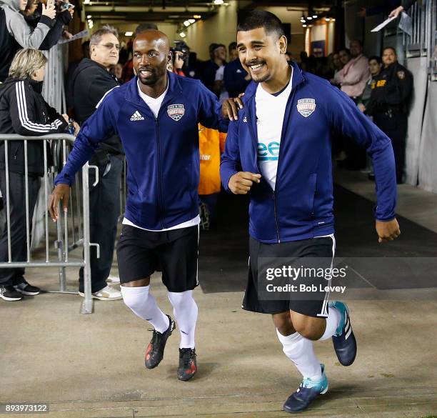 Damarcus Beasley and Maverick Perez are introduced during the Kick In For Houston Charity Soccer Match at BBVA Compass Stadium on December 16, 2017...