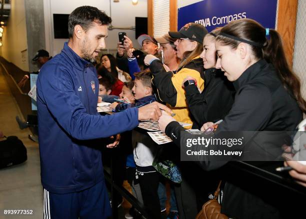 Chris Wondowloski signs autographs during the Kick In For Houston Charity Soccer Match at BBVA Compass Stadium on December 16, 2017 in Houston, Texas.