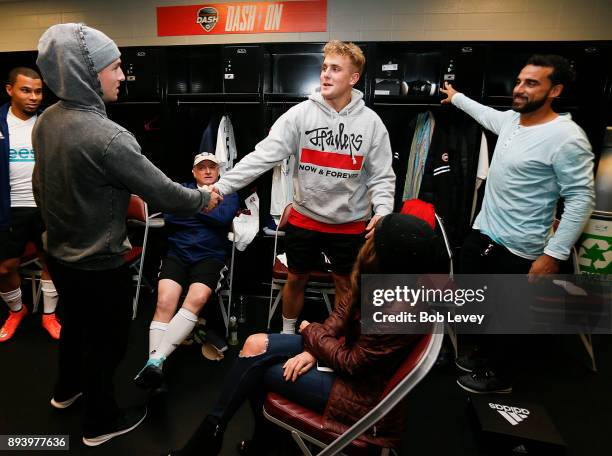 Alex Bregman of the Houston Astros shakes hands with Jake Paul and Dwayne De Rosario shake hands during the Kick In For Houston Charity Soccer Match...