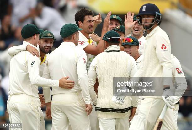 Mitchell Starc of Australia celebrates after taking the wicket of James Vince of England during day four of the Third Test match during the 2017/18...