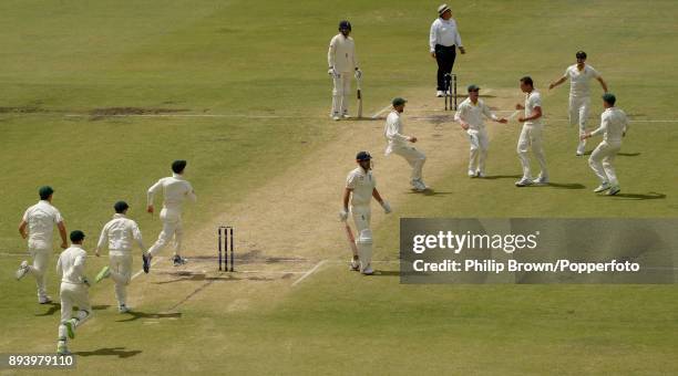 Alastair Cook of England leaves the field after being caught by Josh Hazlewood of Australia on the fourth day of the third Ashes cricket test match...