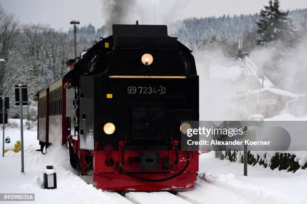 Steam powered locomotive of the Harz Narrow Gauge Railways travels through snow towards the station Brocken on December 16, 2017 in Wernigerode,...