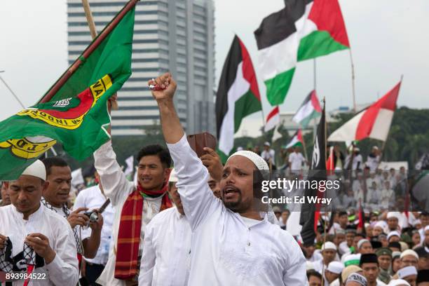 An Indonesian man shouts "God is Great" at a large demonstration against the United States' decision to recognize Jerusalem as the Capital of Israel...