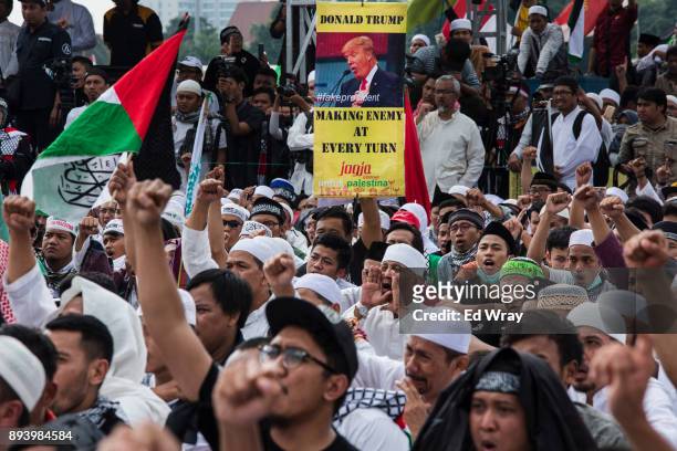 Indonesian men shout slogans at a large demonstration against the United States' decision to recognize Jerusalem as the Capital of Israel on December...