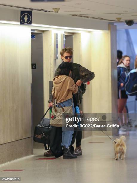 Vanessa Hudgens and Austin Butler are seen at Los Angeles International Airport on December 16, 2017 in Los Angeles, California.