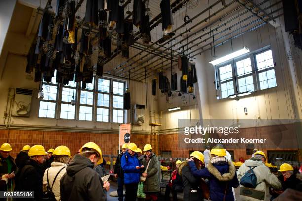 Visitors prepare to enter the Rammelsberg mine to stroll among stalls selling mulled wine and other Christmas goodies at the underground Christmas...