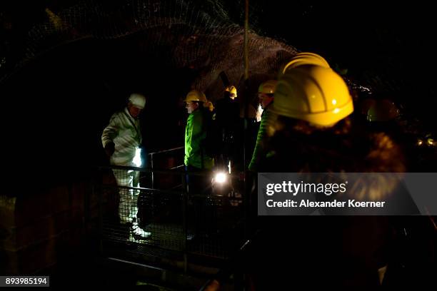 Visitors enter the Rammelsberg mine to stroll among stalls selling mulled wine and other Christmas goodies at the underground Christmas market in the...