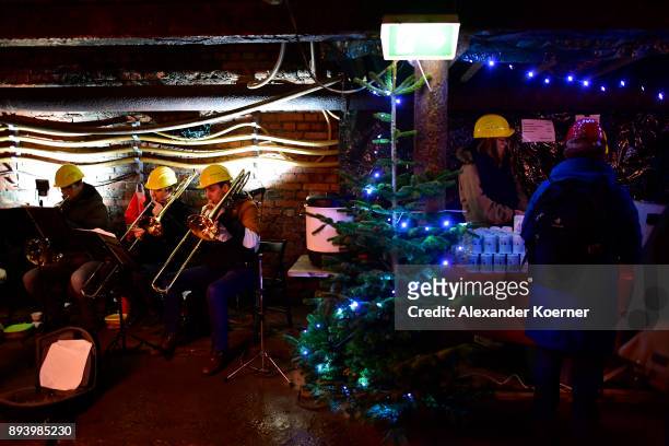 Band plays christmas songs while visitors explore the Rammelsberg mine to stroll among stalls selling mulled wine and other Christmas goodies at the...