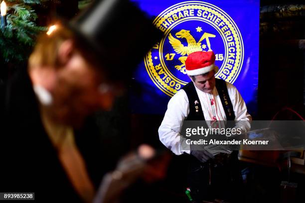 Local workers show their skills to visitors exploring the underground Christmas market in the former Rammelsberg mine on December 16, 2017 in...