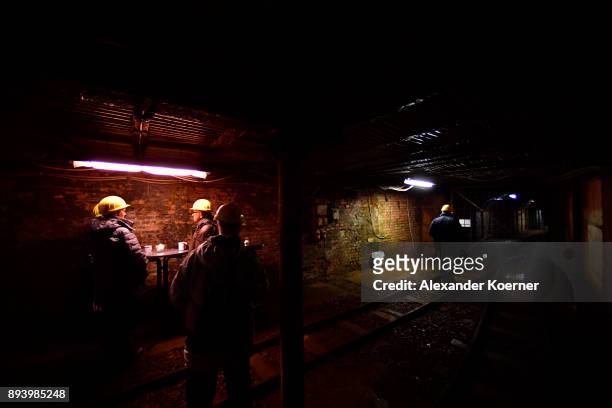 Visitors explore the Rammelsberg mine to stroll among stalls selling mulled wine and other Christmas goodies at the underground Christmas market in...