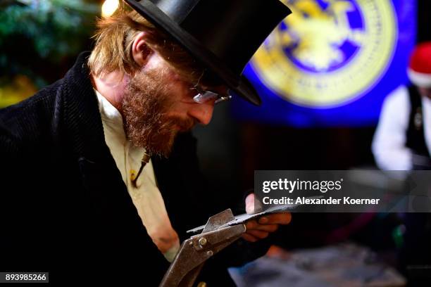 Local workers show their skills to visitors exploring the underground Christmas market in the former Rammelsberg mine on December 16, 2017 in...