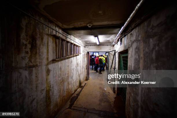 Visitors explore the Rammelsberg mine to stroll among stalls selling mulled wine and other Christmas goodies at the underground Christmas market in...