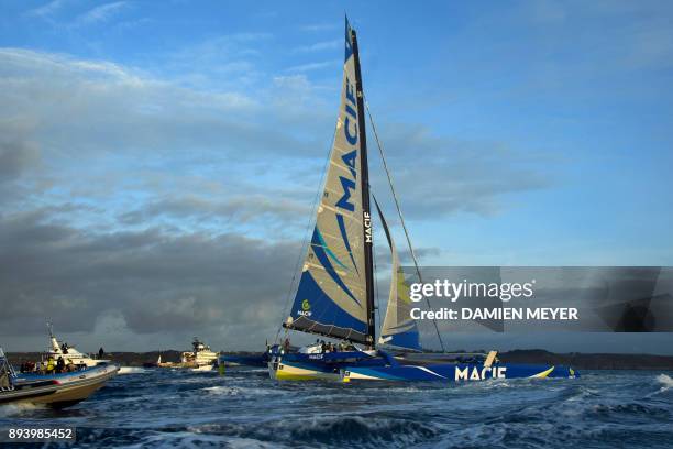 French skipper Francois Gabart sails his trimaran Macif upon his arrival at the end of his solo around the world navigation, on December 17, 2017 in...