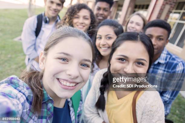 personal perspective of teenagers taking a selfie - organised group photo stock pictures, royalty-free photos & images