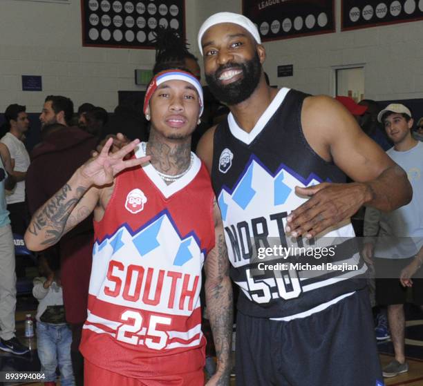 Tyga and Baron Davis pose for portrait at Black Santa Celebrity Basketball Fundraiser on December 16, 2017 in Santa Monica, California.