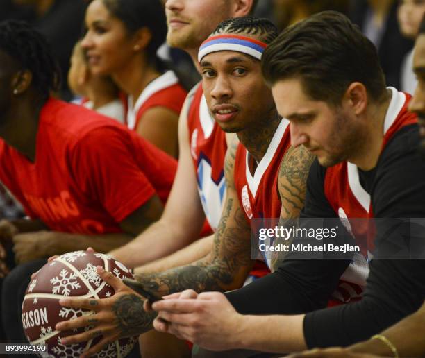 Tyga on bench at Baron Davis hosts Black Santa Celebrity Basketball Fundraiser on December 16, 2017 in Santa Monica, California.