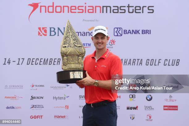 Justin Rose of England pose with the trophy after winning the 2017 Indonesian Masters at Royale Jakarta Golf Club on December 17, 2017 in Jakarta,...