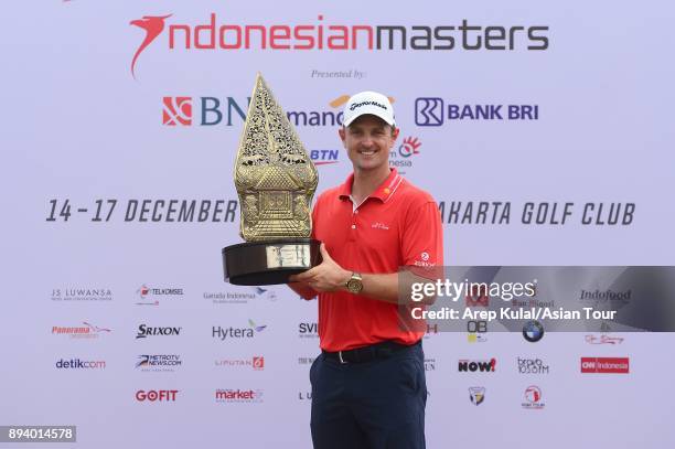 Justin Rose of England pose with the trophy after winning the 2017 Indonesian Masters at Royale Jakarta Golf Club on December 17, 2017 in Jakarta,...