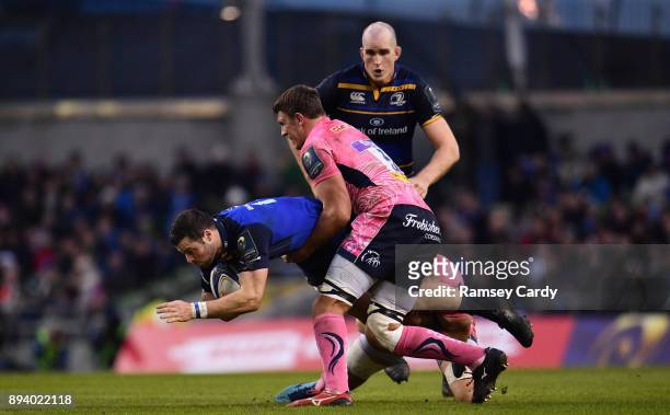 Dublin , Ireland - 16 December 2017; Robbie Henshaw of Leinster is tackled by Sam Skinner of Exeter Chiefs during the European Rugby Champions Cup...
