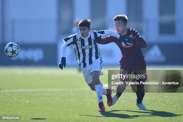 Player of Juventus U15 and player of Torino FC U15 compete during the match between Juventus U15 and Torino FC U15 at Juventus Center Vinovo on...