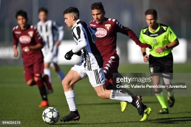 Player of Juventus U15 and player of Torino FC U15 compete during the match between Juventus U15 and Torino FC U15 at Juventus Center Vinovo on...