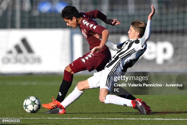 Player of Juventus U15 and player of Torino FC U15 compete during the match between Juventus U15 and Torino FC U15 at Juventus Center Vinovo on...