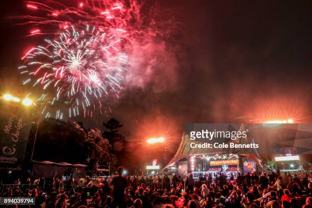 The crowd holds candles back dropped by the city during Woolworths Carols in the Domain on December 17, 2017 in Sydney, Australia. Woolworths Carols...