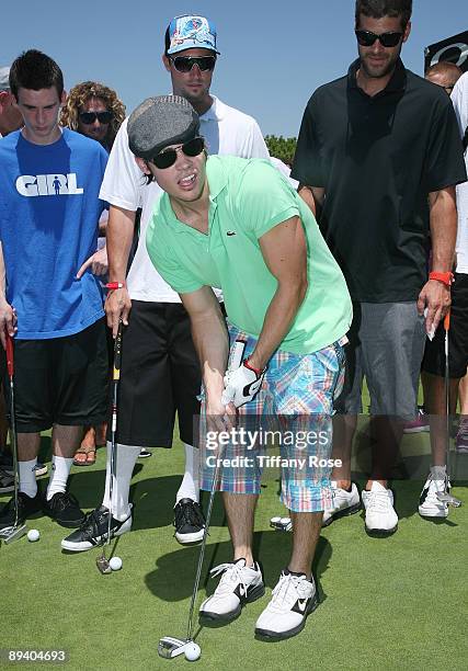 Actor Josh Henderson tries to make a hole in one at the 2nd Annual Ryan Sheckler X Games Celebrity Skins Classic at Coto de Caza Golf and Racquet...