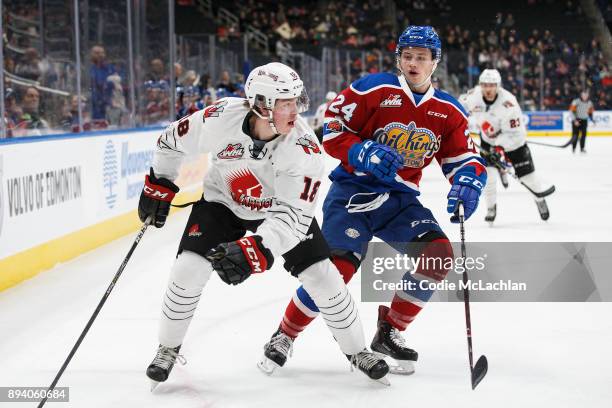 Brett Kemp of the Edmonton Oil Kings skates against Tate Popple of the Moose Jaw Warriors at Rogers Place on December 7, 2017 in Edmonton, Canada.