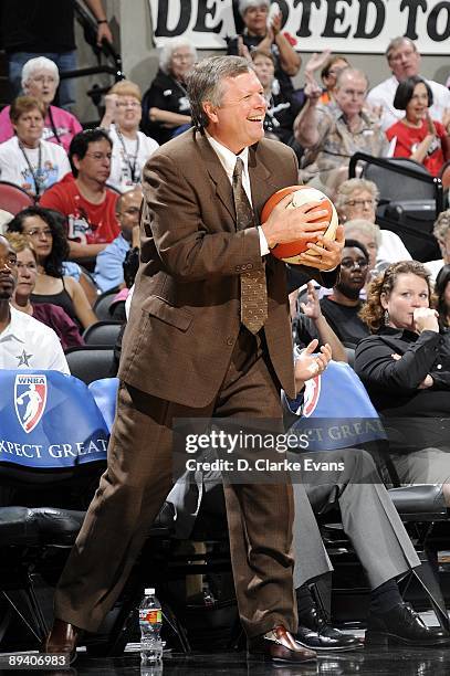 Head coach Dan Hughes of the San Antonio Silver Stars smiles as he catches a loose ball during the game against the Indiana Fever at AT&T Center on...