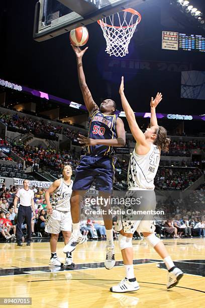 Jessica Davenport of the Indiana Fever shoots a layup against Megan Frazee of the San Antonio Silver Stars at AT&T Center on July 23, 2009 in San...