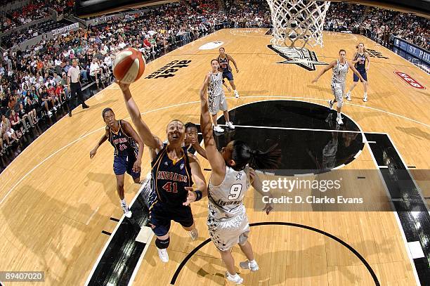 Tully Bevilaqua of the Indiana Fever shoots a layup against Edwige Lawson-Wade of the San Antonio Silver Stars during the game at AT&T Center on July...