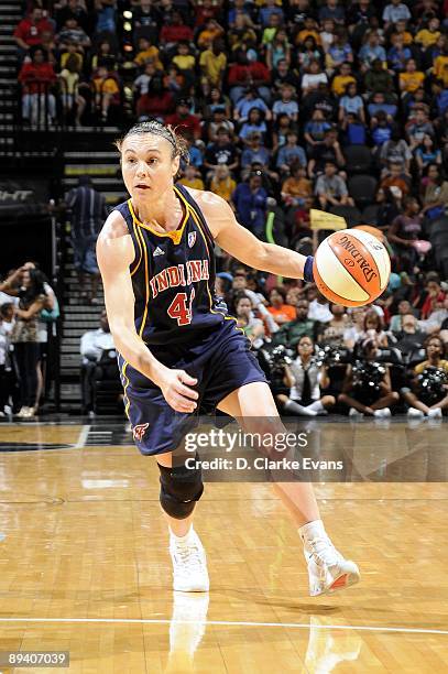 Tully Bevilaqua of the Indiana Fever moves the ball up court during the game against the San Antonio Silver Stars at AT&T Center on July 23, 2009 in...