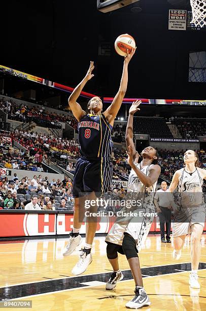 Tammy Sutton-Brown of the Indiana Fever goes up for a shot against Sophia Young of the San Antonio Silver Stars during the game at AT&T Center on...