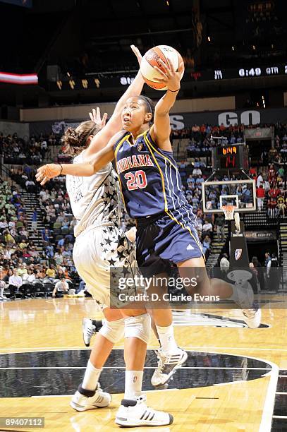 Briann January of the Indiana Fever shoots a layup against Megan Frazee of the San Antonio Silver Stars during the game at AT&T Center on July 23,...