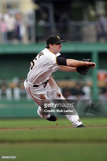 Andy LaRoche of the Pittsburgh Pirates throws over to first base during the game against the San Francisco Giants at PNC Park on July 18, 2009 in...