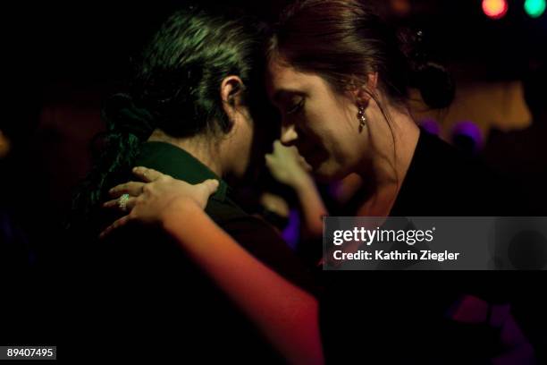 couple at milonga, dancing tango - tango argentina stock pictures, royalty-free photos & images